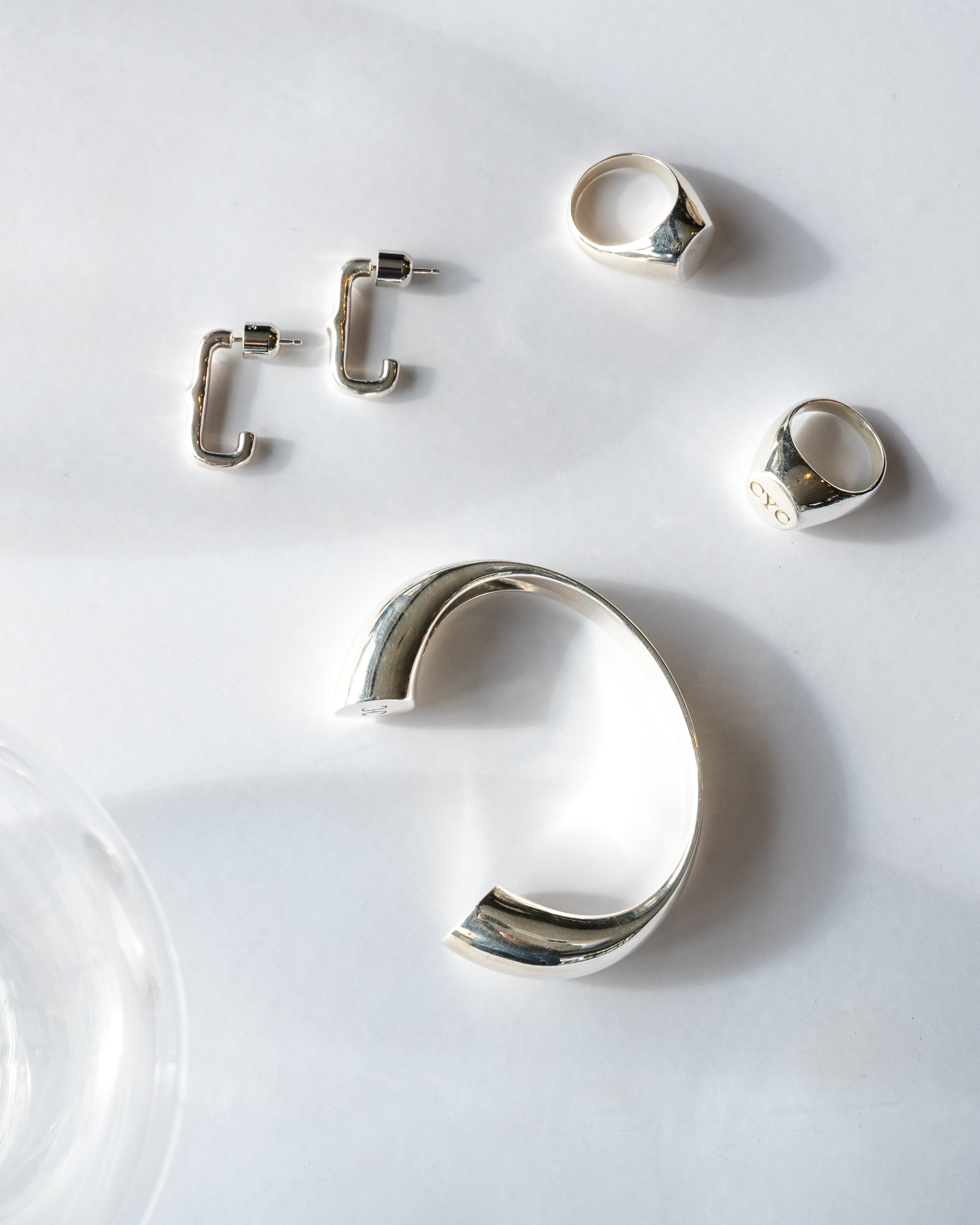 Huggie Earring in silver with matching rings and cuff