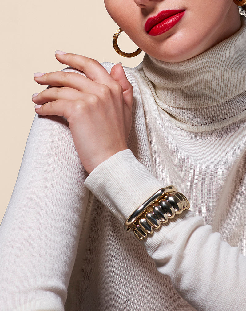 Model in white wearing Heritage Cuff