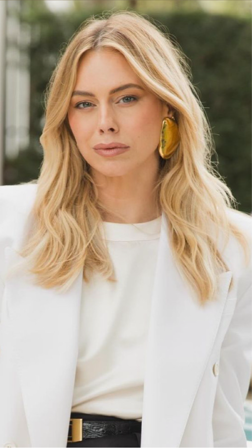 Blonde woman in white wearing Oval Earring in gold