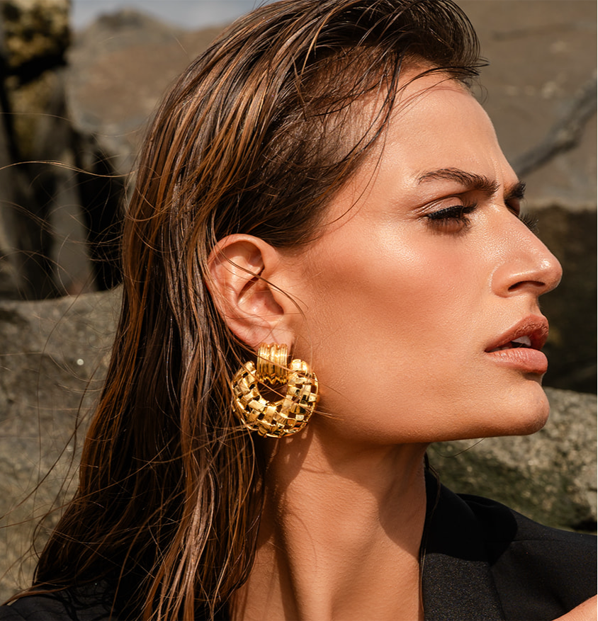 Model in black wearing Woven Frontal Hoop Earring