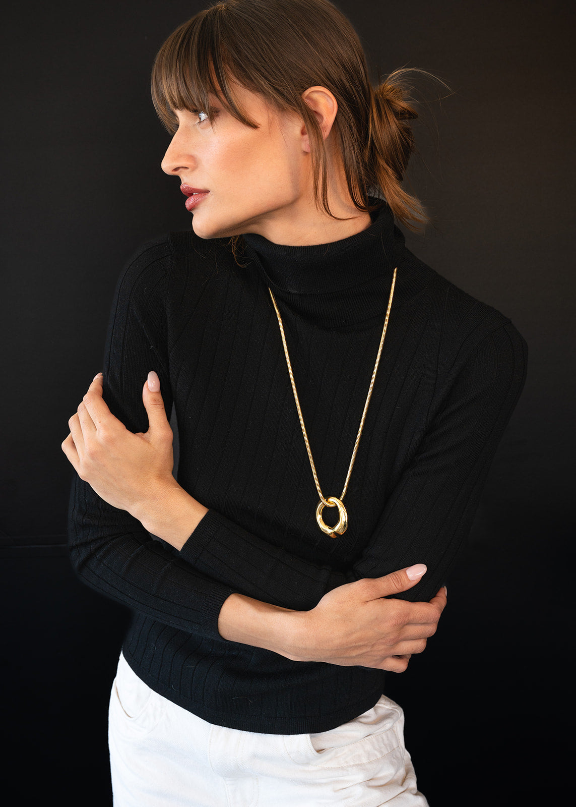 Model in black wearing Organic Circle Pendant