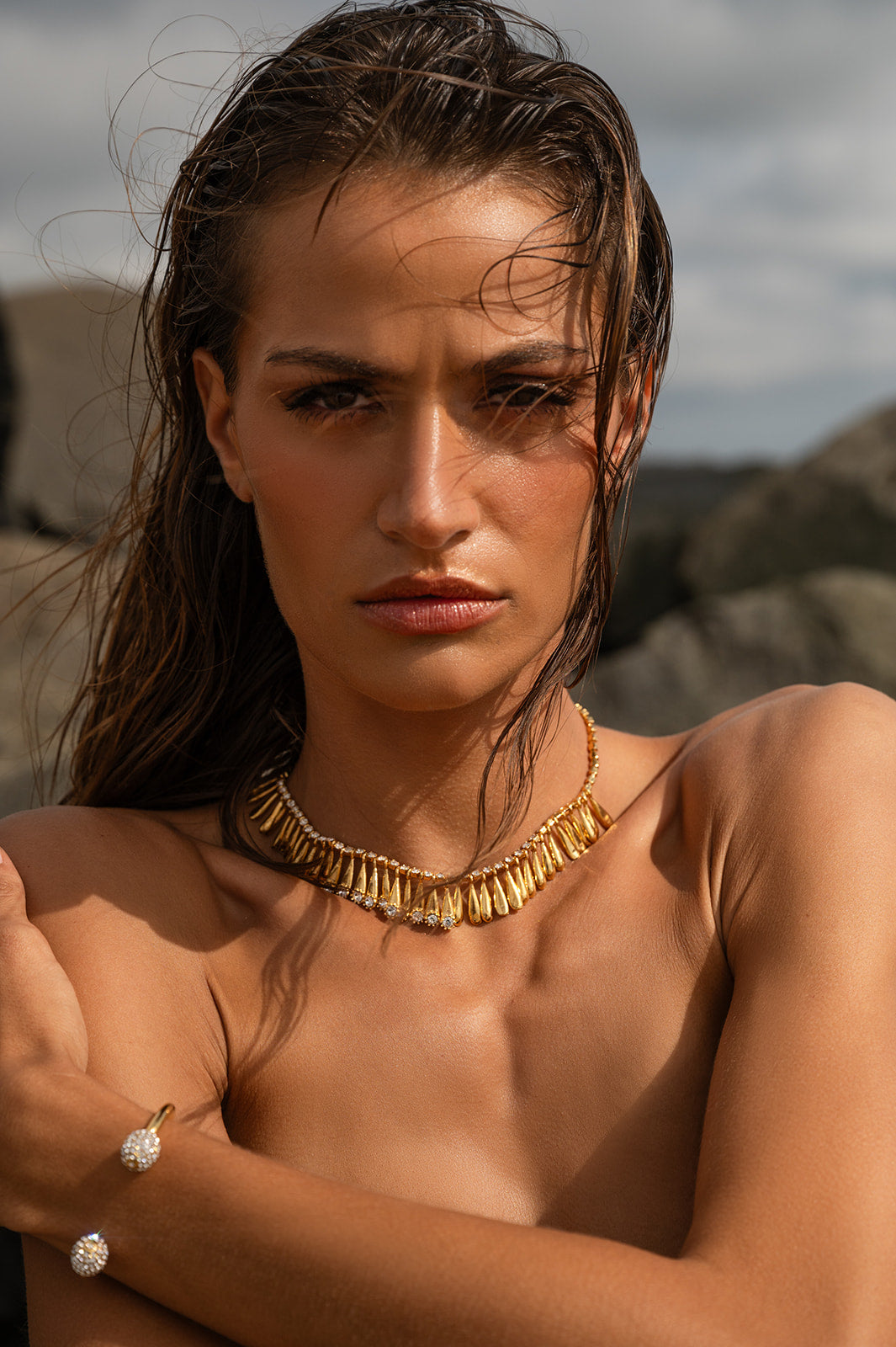 Model wearing Fringe Teardrop Necklace and a bracelet