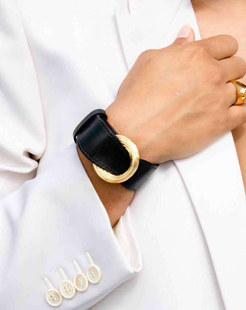 Model in white wearing a Leather Bracelet